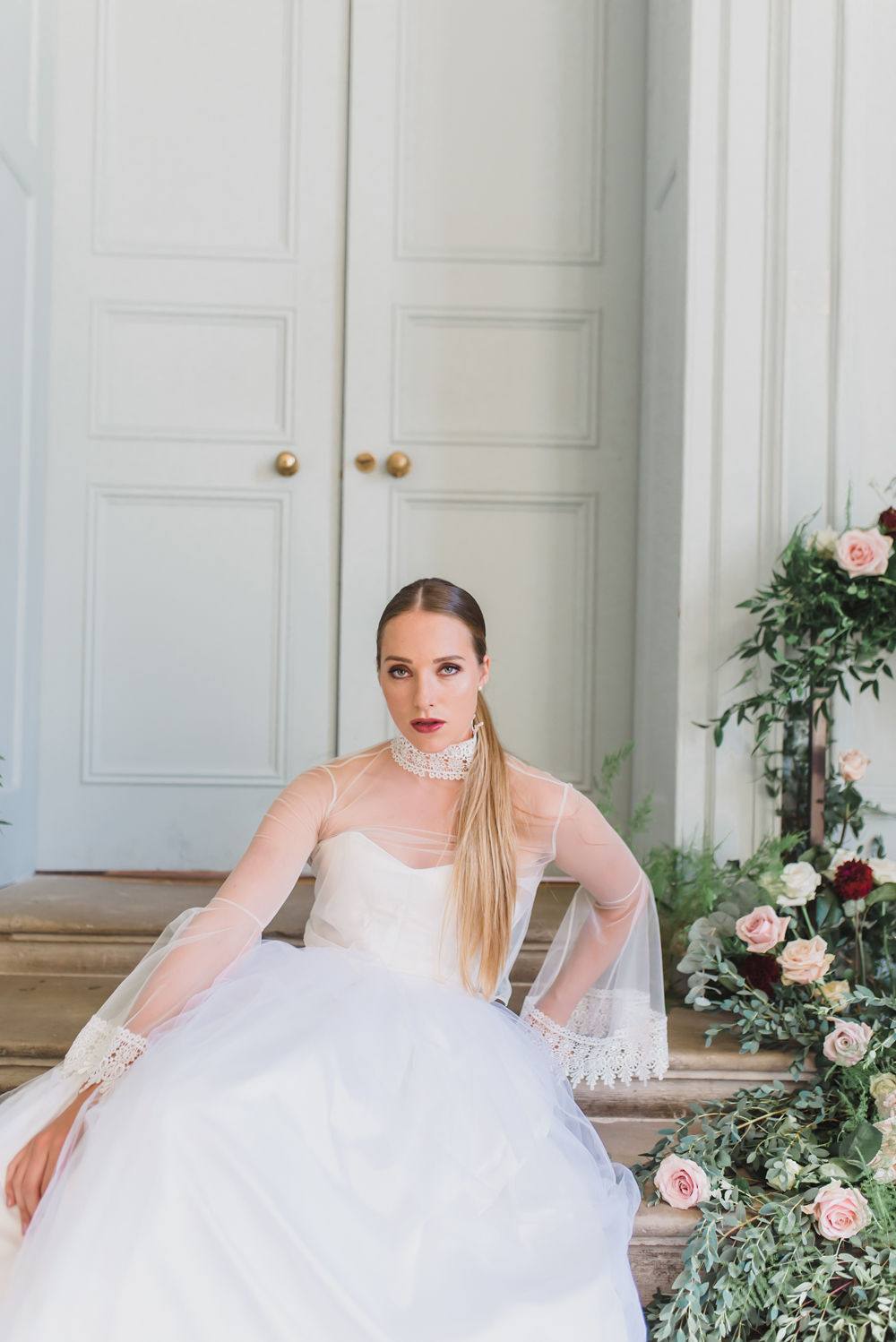 Elegant wedding inspiration in English country mansion Shaw House. Jewel tones, grand bridal inspiration, styled shoot, statement sleeves, floral installation, big floral arrangements, big floral display, jewel tone bridal bouquet, sage green and pink colour scheme