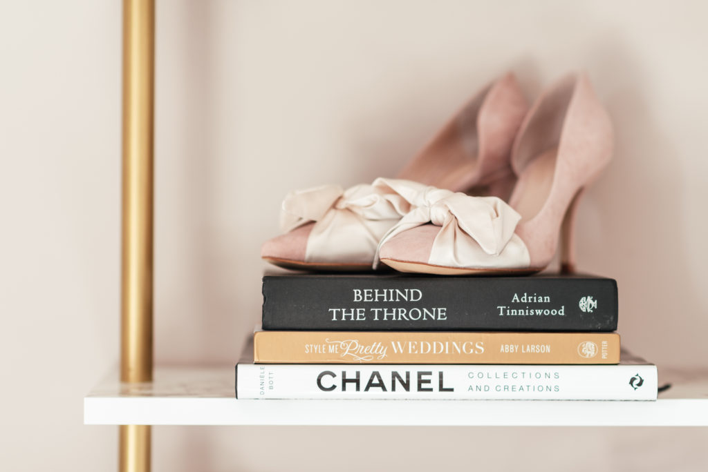 Shoes on top of luxury brand design books