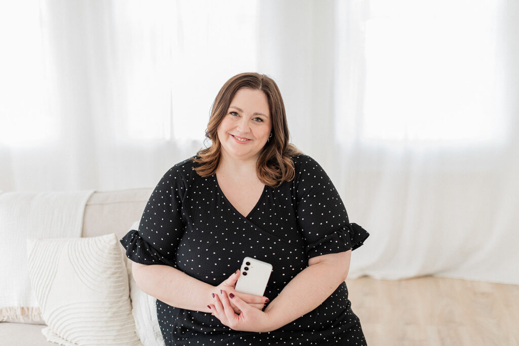 Sarah Shuttle, luxury brand designer, smiling at the camera — showing the warmth behind high-end branding.