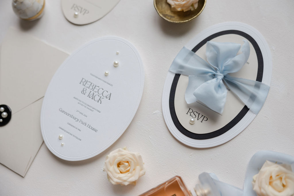 Modern stationery and wedding details in blue, black and peach for editorial
