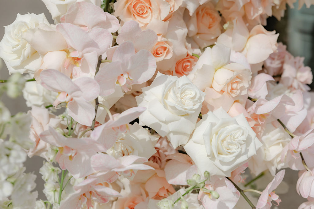 Light and airy editorial wedding shoot with pastel floral details styled for a luxury brand.