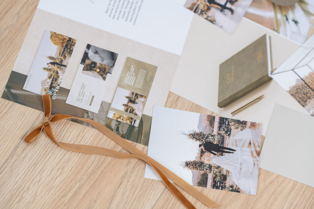 Luxury brand design project print outs laid out on a desk during the design process